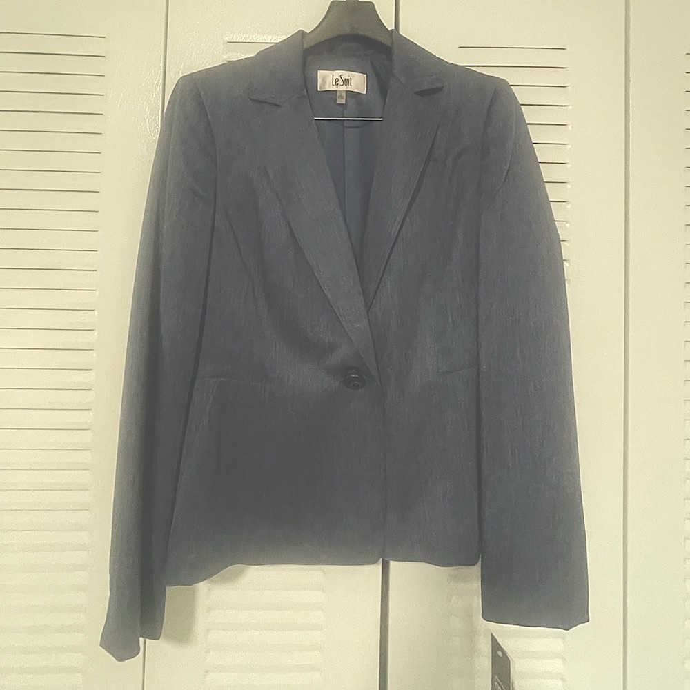 New suit. Material feels smooth but has a Jean like appearance.